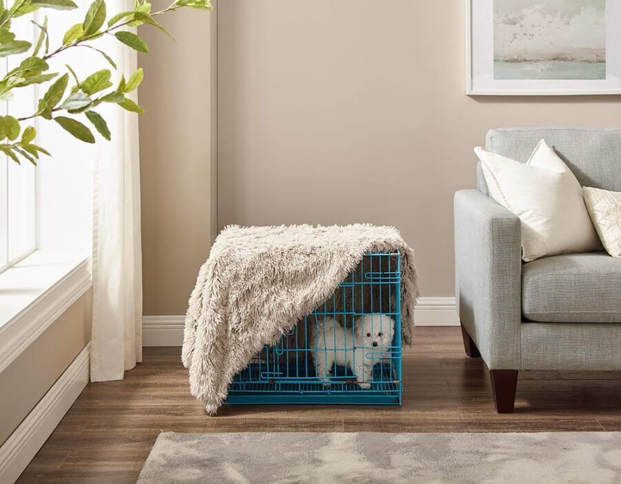 Crate training outlet cover with blanket